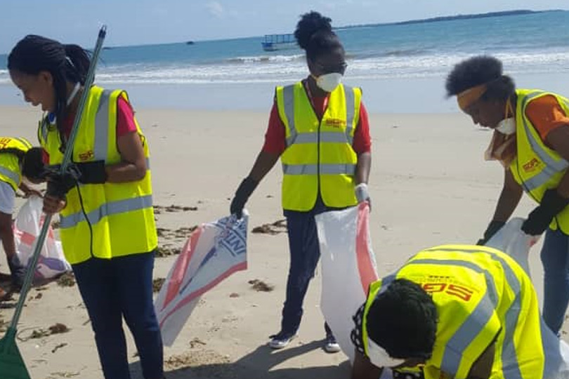 SGA personnel cleaning up the beach