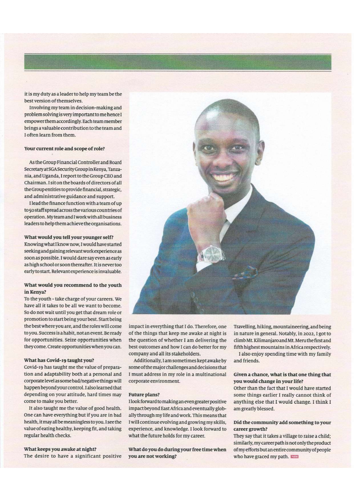 Joseph Thuku poses for newspaper clipping