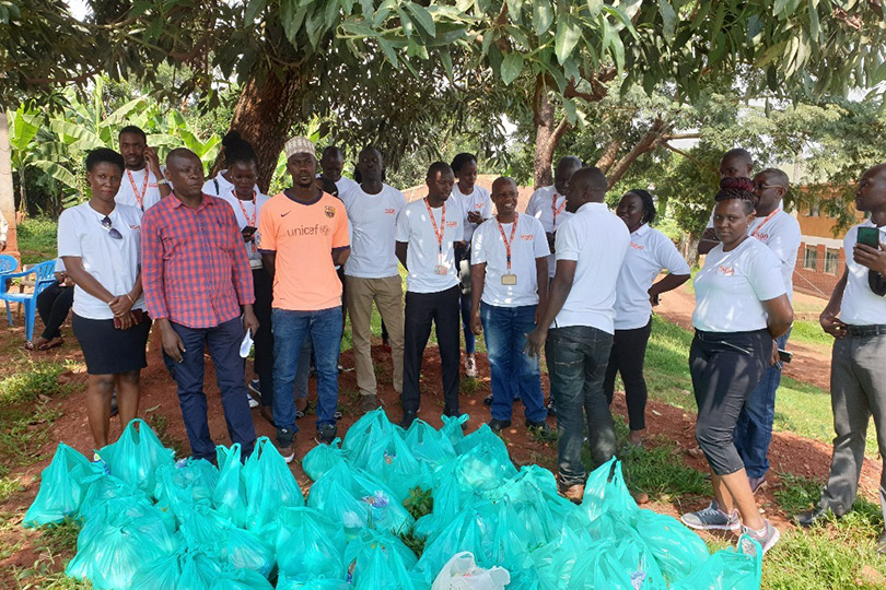 SGA personnel posing with litter bags