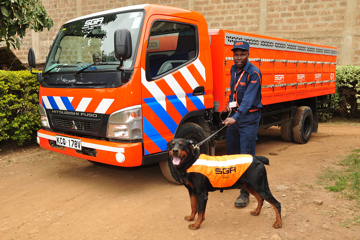 SGA security personnel handling a security dog