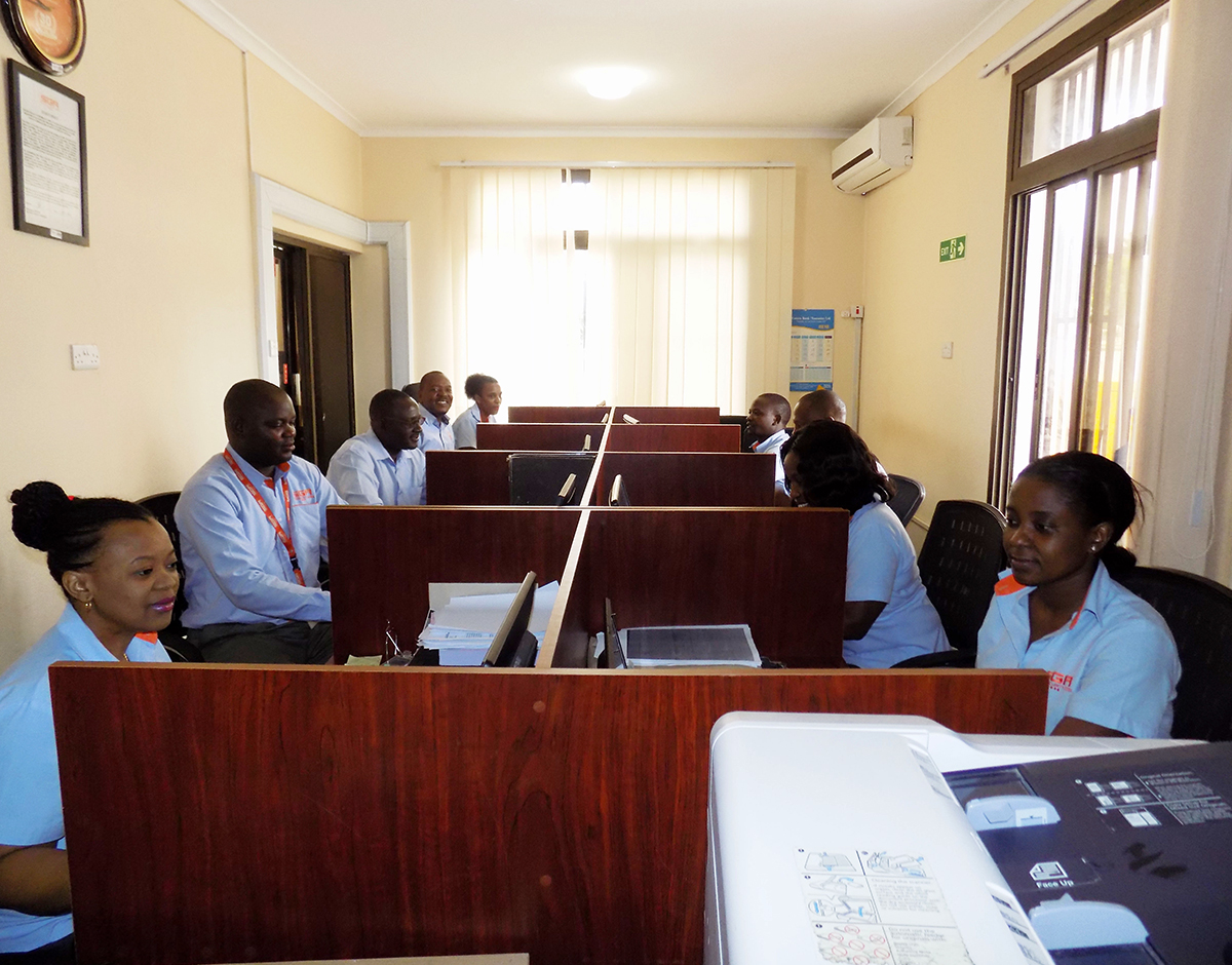 SGA Employees seated at their work desks