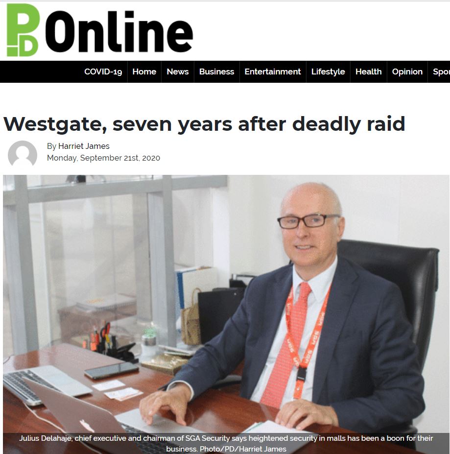 Man sitting at his desk on newspaper clipping